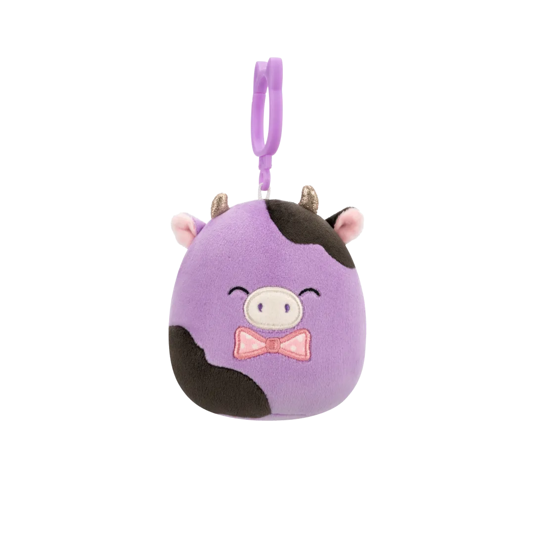 Squishmallows Clip-On Alexie la Vaca Morada y Negra con Pajarita, 9 cm